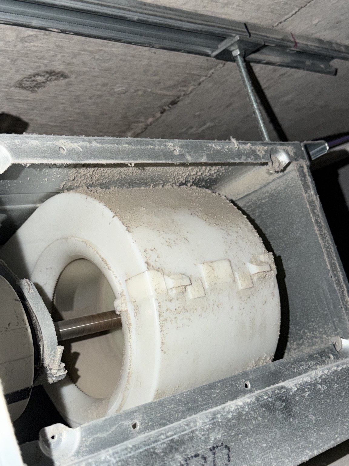 Dust-caked blower wheel found on a neglected air conditioning unit